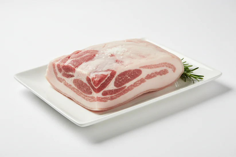 Raw Iberico pork jowl with high-oleic marbling. Perfect for guanciale, curing, or slow cooking. Vacuum sealed and frozen for freshness.
