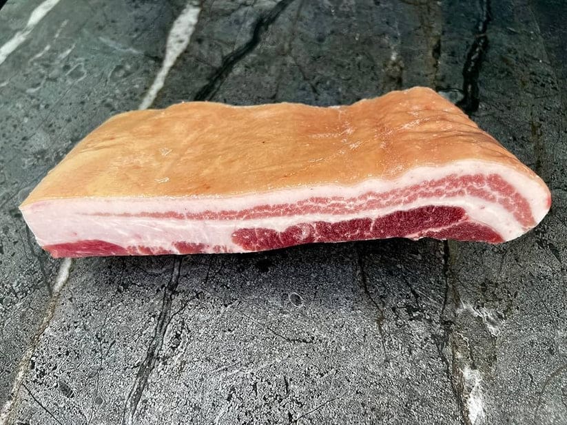 Premium Iberico pork belly with rich marbling, ideal for bacon, roasting, or braising. Fresh, never frozen. Approx. 5 lb.